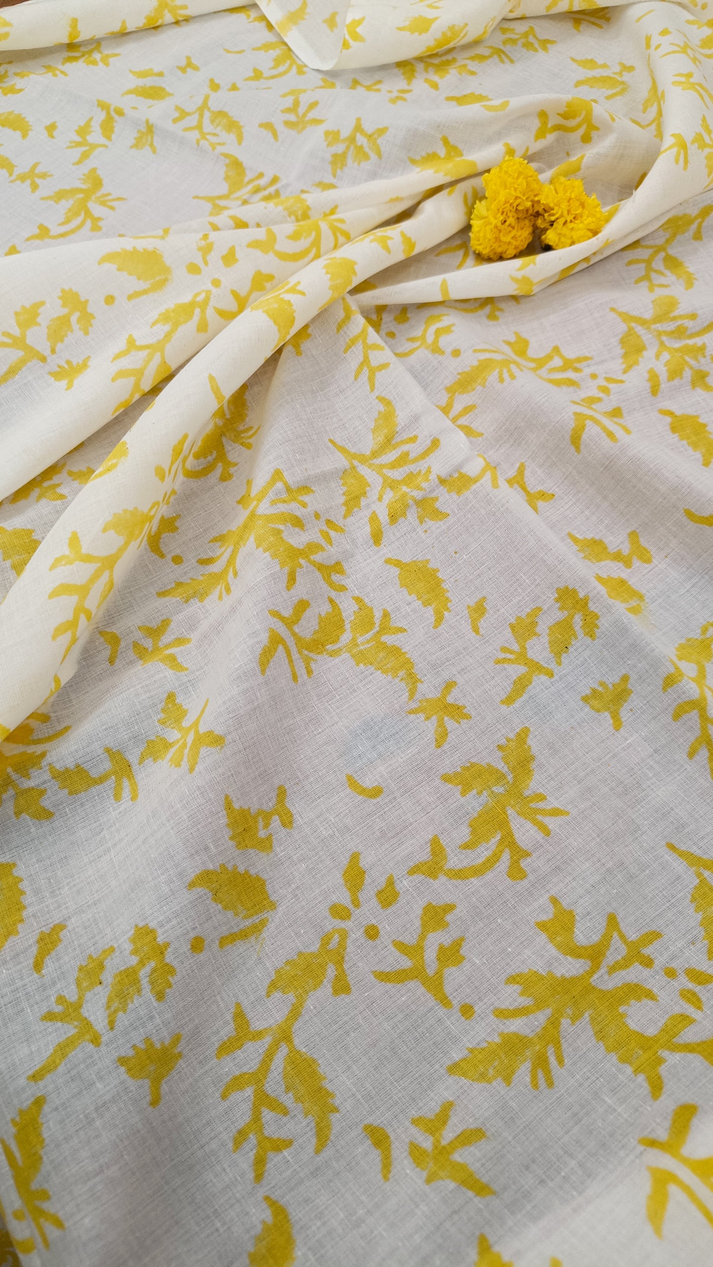 Elegant floral-printed yellow cotton saree with a running blouse piece, perfect for festive mornings at Phulwari Bazaar