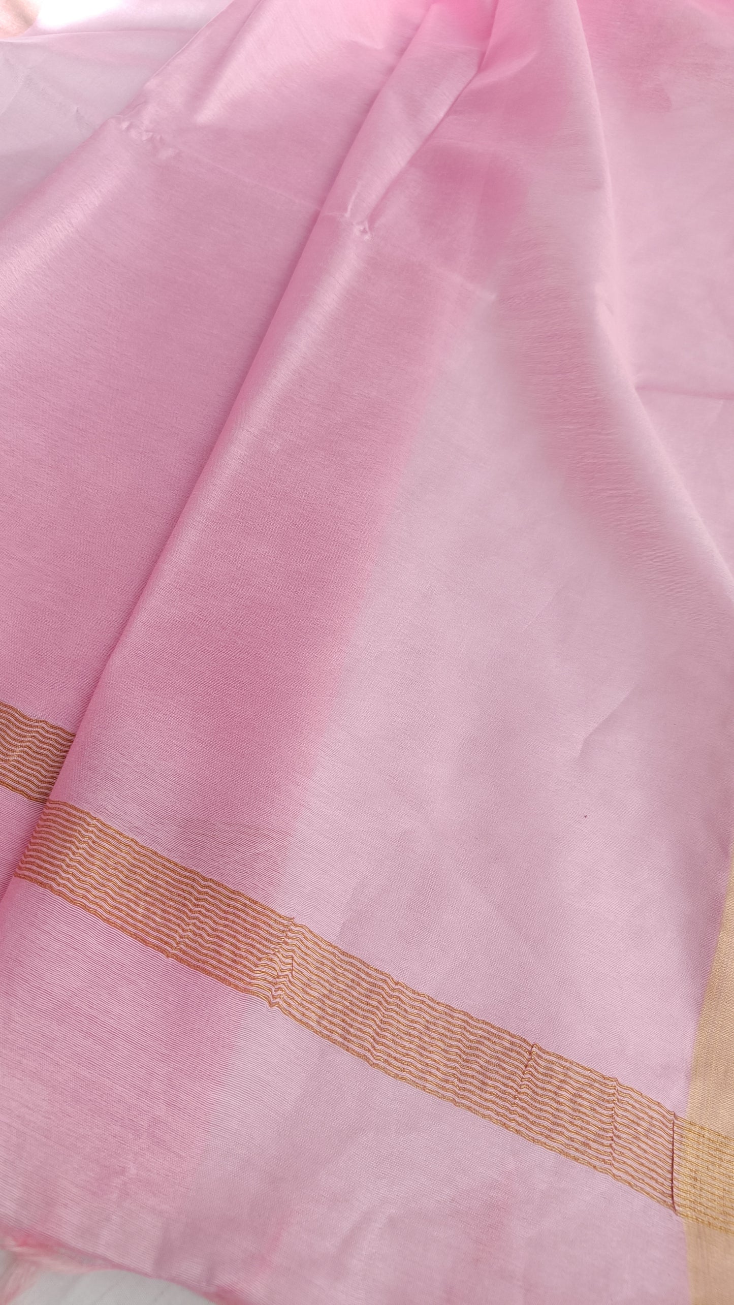 Matching soft pink blouse piece with gold zari detailing, included with the Cherry Blossom saree, available at Phulwari Bazaar