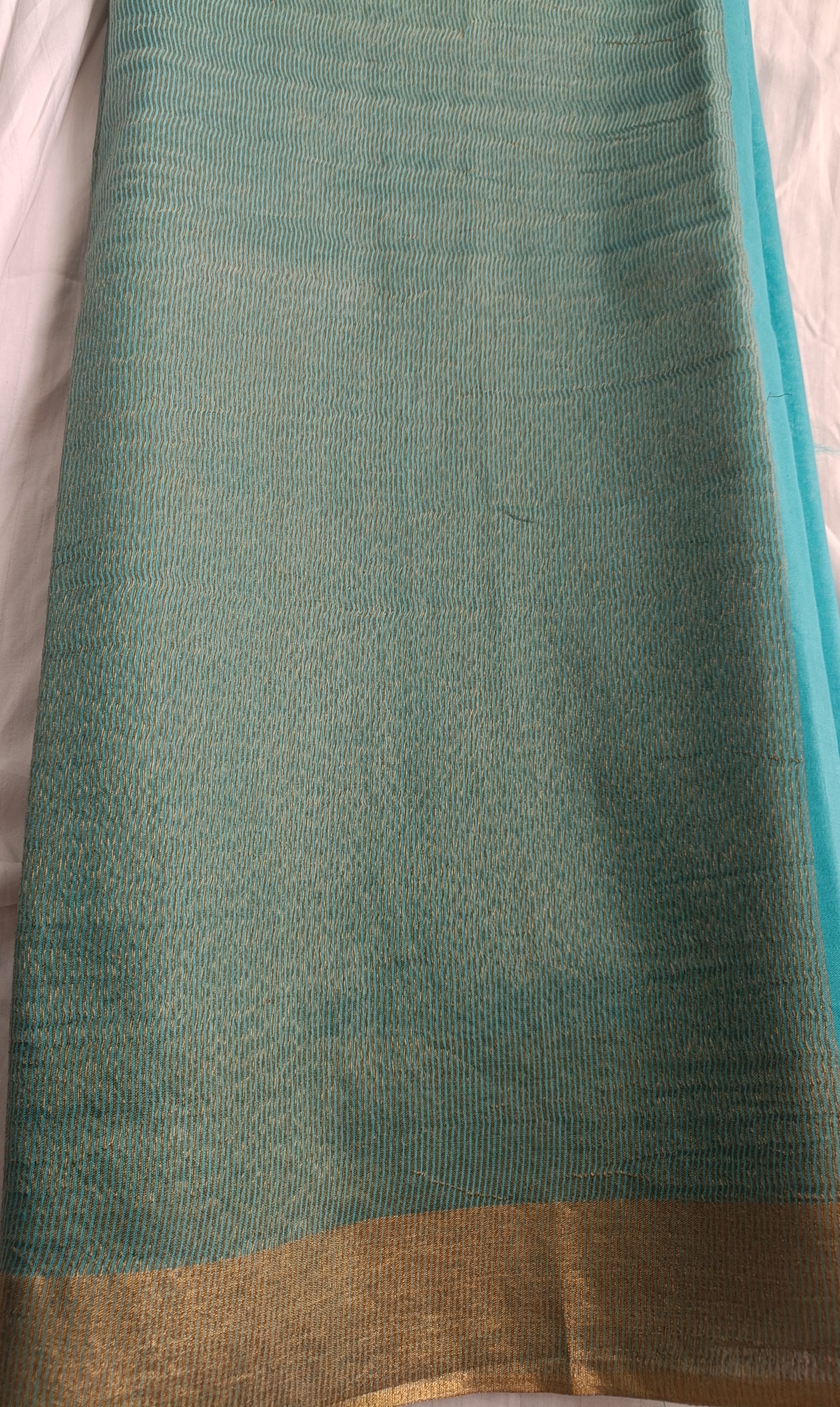 Close-up of pallu with gold zari work on Ocean Lush Chanderi silk saree, available at Phulwari Bazaar.