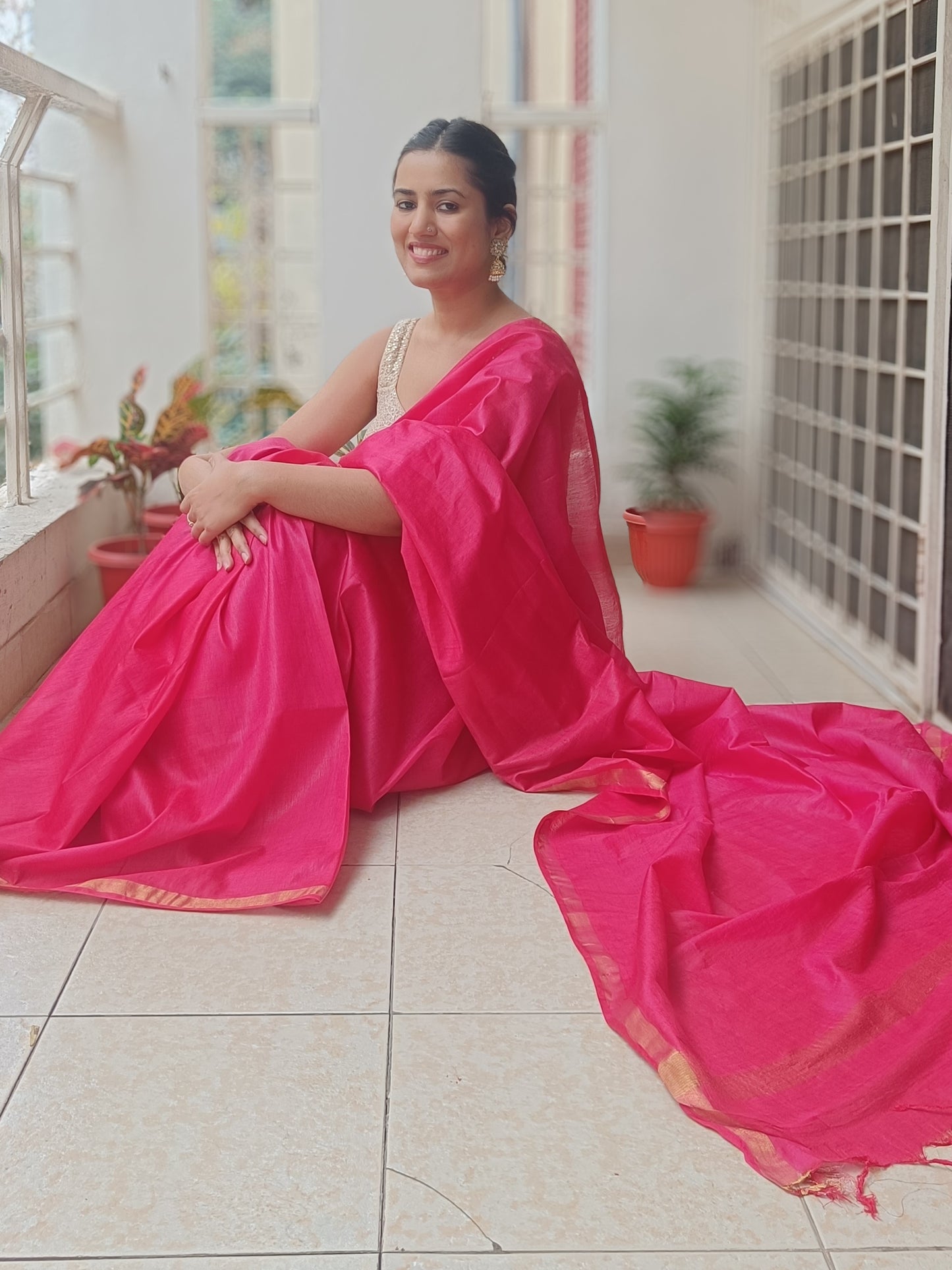 Close-up of the pallu on Flamingo Fire saree, showcasing gold zari detailing on Chanderi cotton silk fabric, available at Phulwari Bazaar.