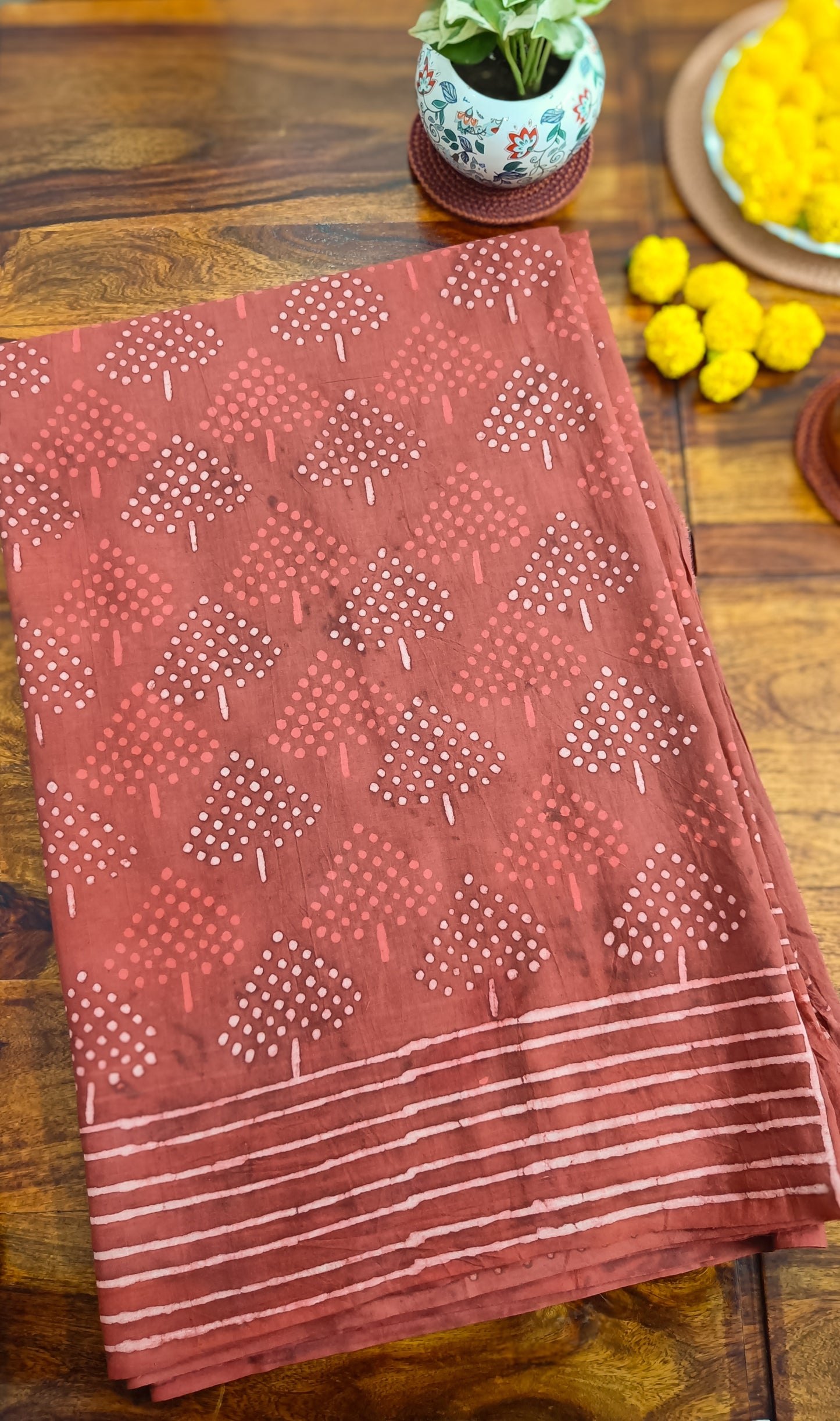 Close-up of Ruby Rouge handprinted Sangneri pattern on Mulmul cotton saree, intricate and artisanal