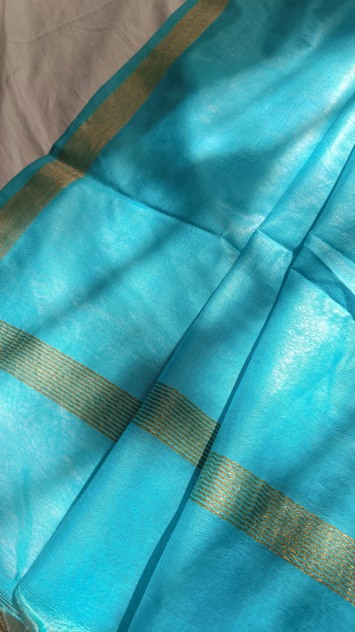 Close-up of the gold zari border and pallu of Turquoise Temptation saree, Phulwari Bazaar