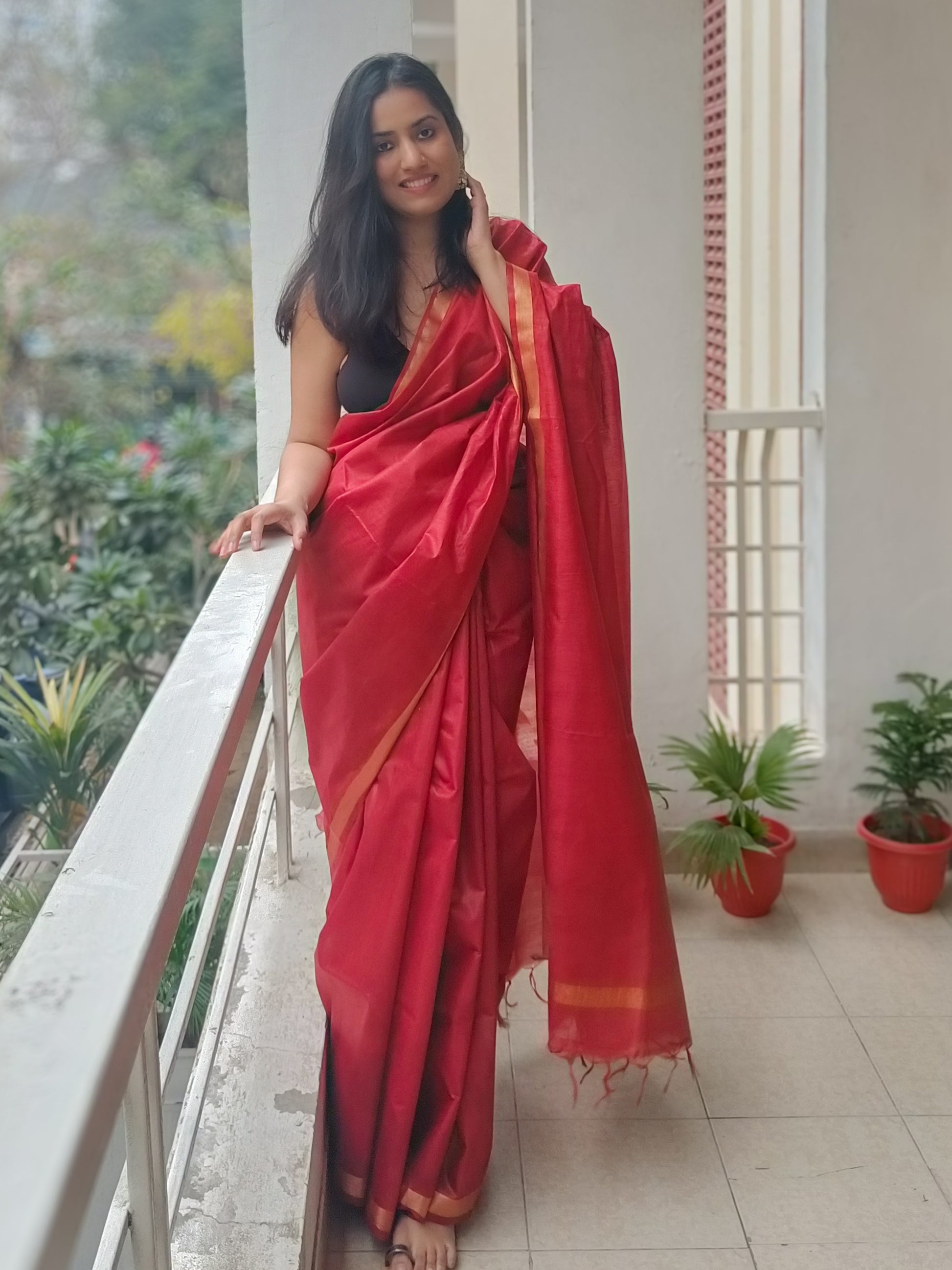 Vibrant red Cherry Bomb saree draped gracefully, showcasing its soft fabric, from Phulwari Bazaar