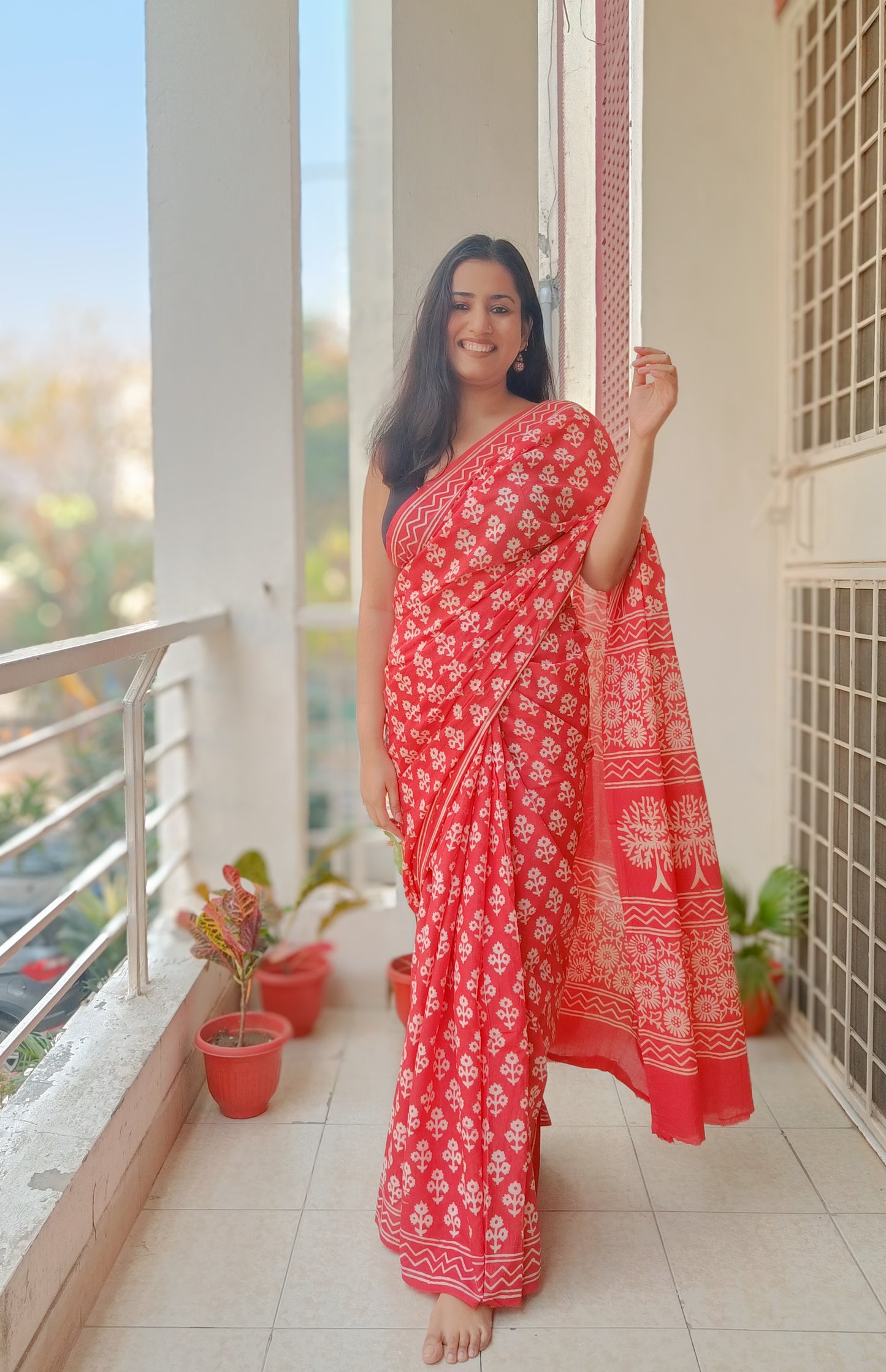 Bright orange handprinted cotton saree with classic Sangneri motifs, ideal for cultural events,  Phulwari Bazaar