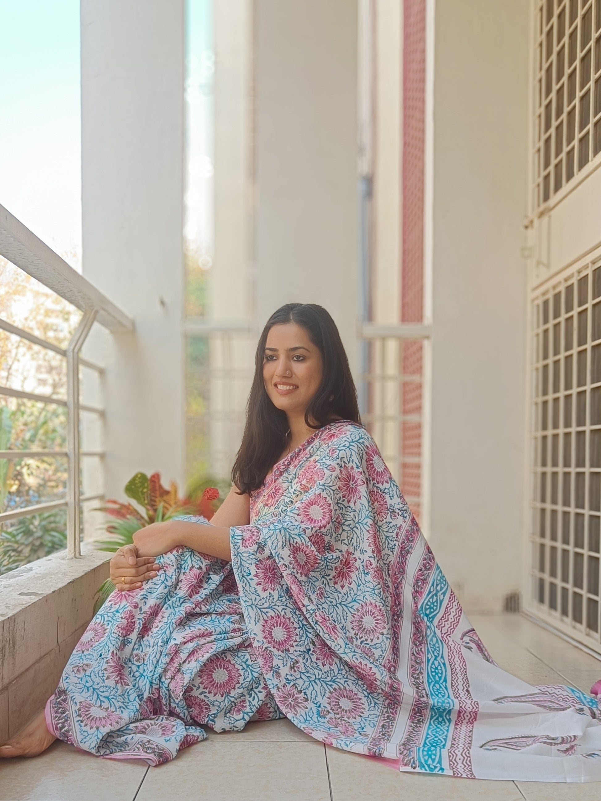 Handprinted floral Mulmul cotton saree with sapphire leaves and pink blooms, lightweight and breathable fabric,  Phulwari Bazaar