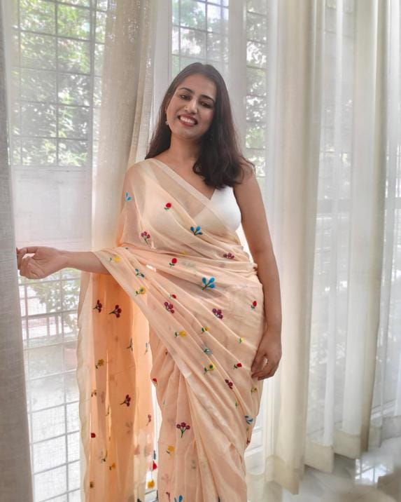 Bela from Phulwari Bazaar - soft beige muslin mulmul saree with floral embroidery and tassels, lightweight breathable fabric from Bengal