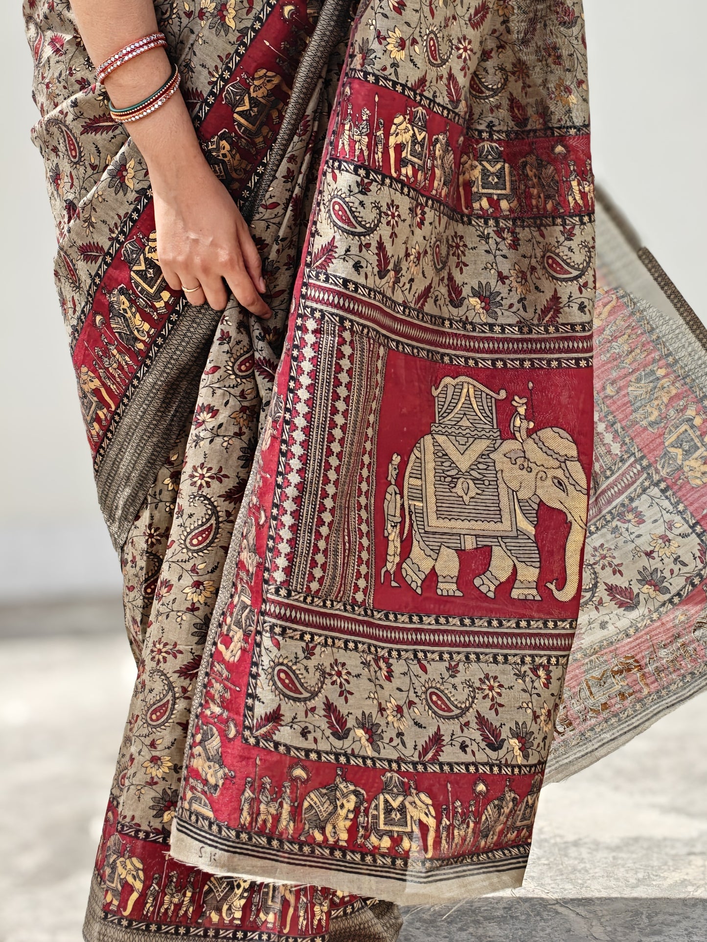 Detailed pallu of handloom bamboo silk saree featuring black elephant block prints on maroon base, artisan-made saree| Phulwari Bazaar