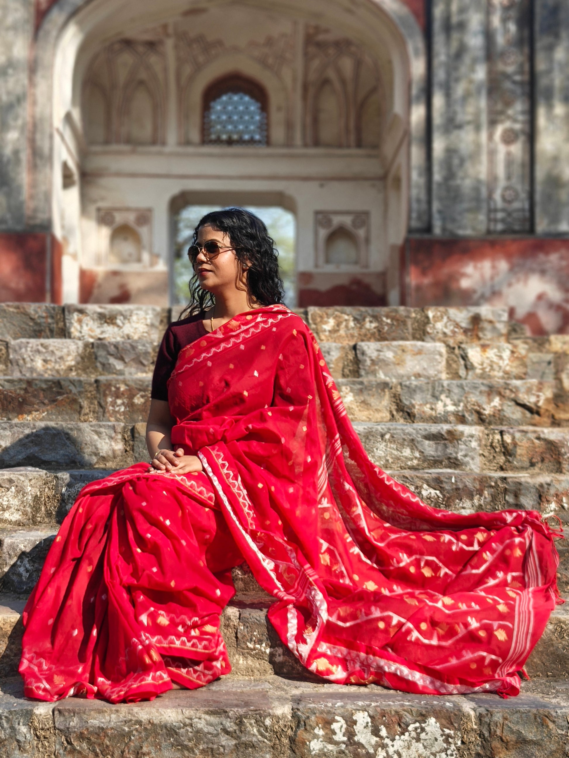 Red Jamdani saree with woven butas and tassels – elegant and breathable. Phulwari Bazaar| Phulwari Bazar