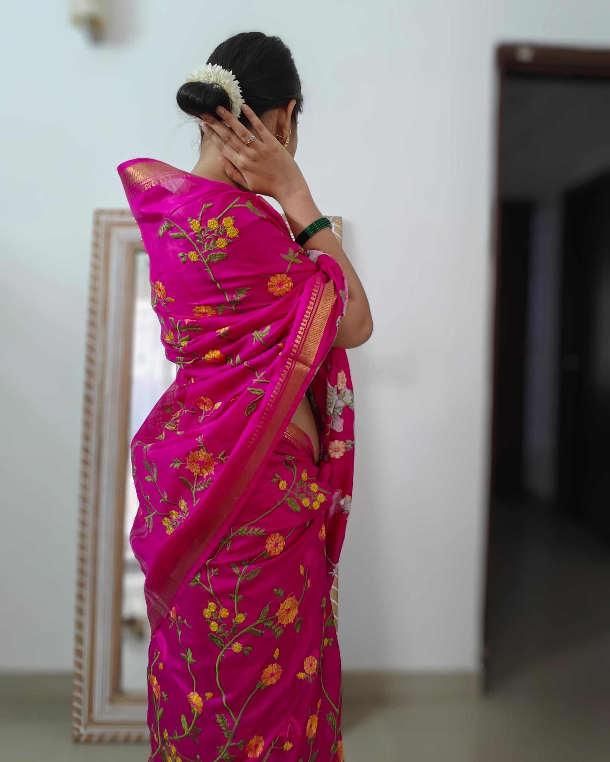 Detailed floral embroidery on Rani pink pure mulberry silk saree from Phulwari Bazaar